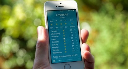 A mobile phone showing high temperatures in Liverpool, UK.