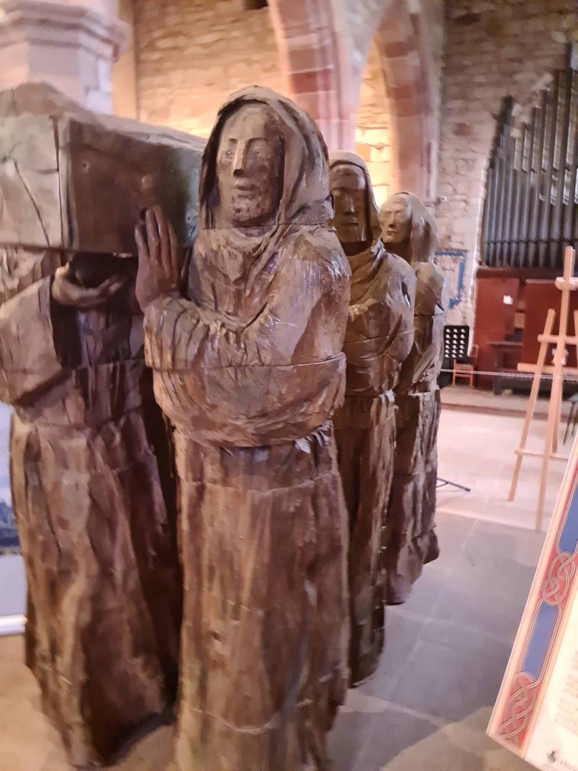 Statue of monks carrying St Cuthbert's coffin out of Lindisfarne, kept at St Mary's Church. Image: 360onhistory.com