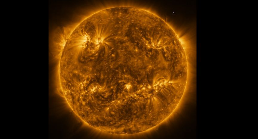 The Sun as seen by Solar Orbiter in extreme ultraviolet light from a distance of roughly 75 million kilometres. The image is a mosaic of 25 individual images taken on 7 March by the high resolution telescope of the Extreme Ultraviolet Imager (EUI) instrument. An image of Earth is also included for scale, at the 2 o’clock position. Credit: ESA & NASA/Solar Orbiter/EUI team; Data processing: E. Kraaikamp (ROB)