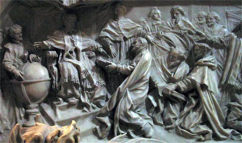 Detail of the pope's tomb by Camillo Rusconi (completed 1723); Antonio Lilio is genuflecting before the pope, presenting his printed calendar. (Wikipedia)