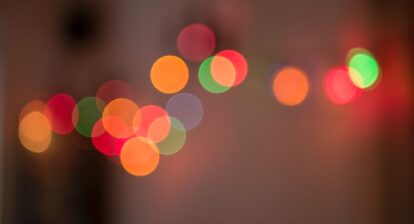 Red, green and orange dots of light
