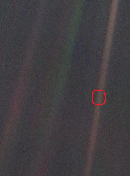 THE PALE BLUE DOT OF EARTH "That's here. That's Home. That's us."Image captured by Voyager spacecraft of our planet shown as a pale blue dot.