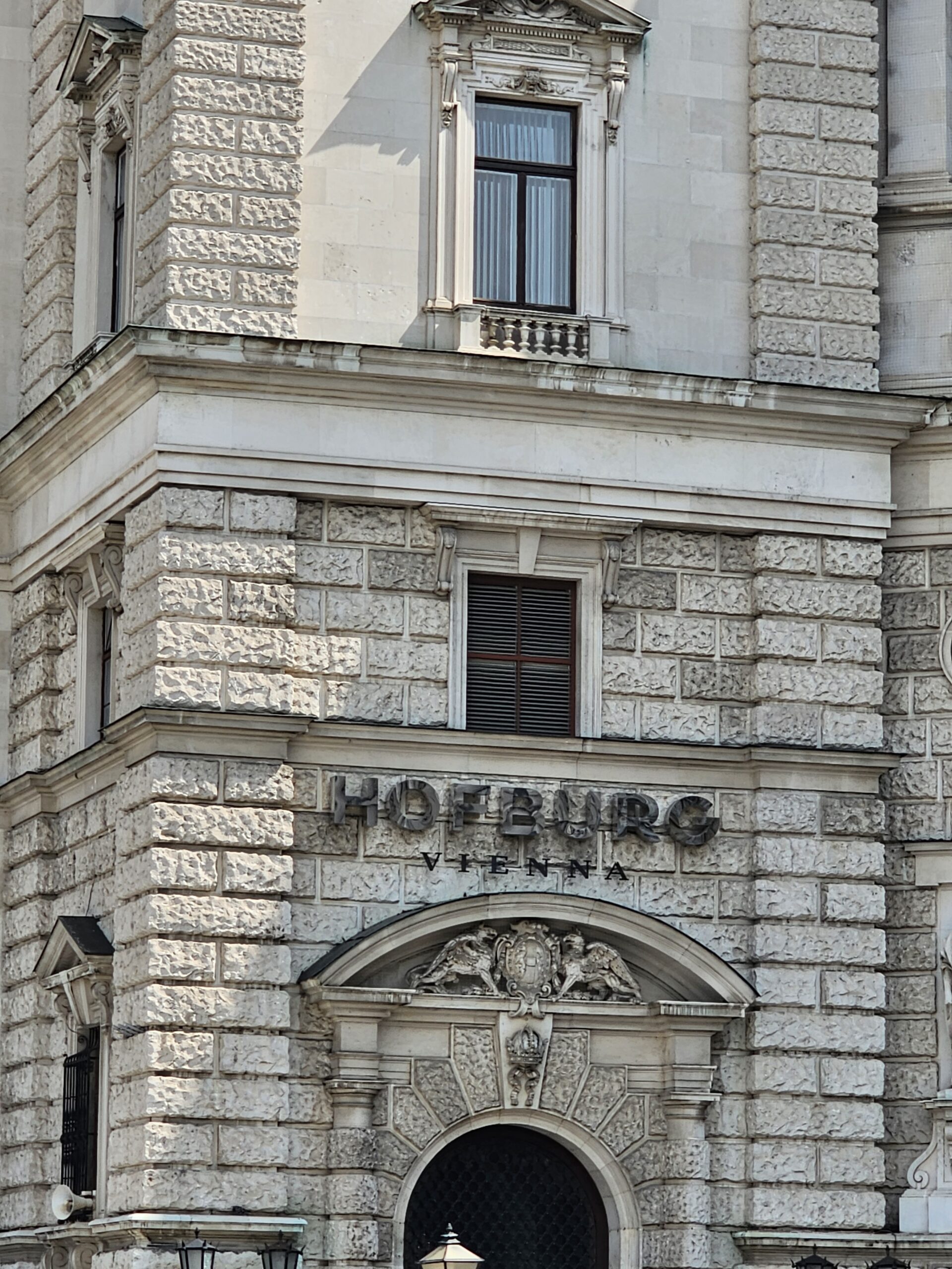 Side building of Hofburg Palace with Hofburg written on it.