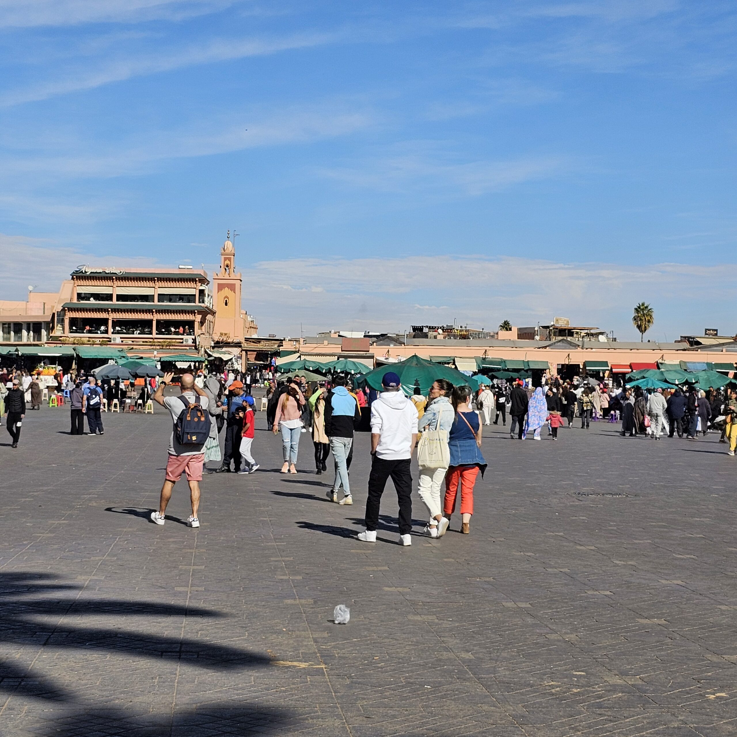 Jemma el Fnaa Square in Marrakesh. By 360onhistory.com. Families can be seen walking towards the stalls in the main square.
