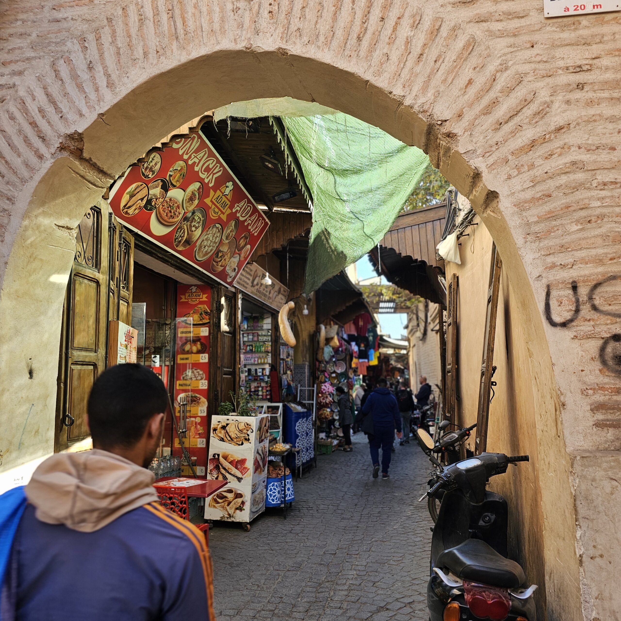 A small side street, through an archway, one of many in Jemaa El Fnaa, Marrakesh. Image by 360onhistory.com
