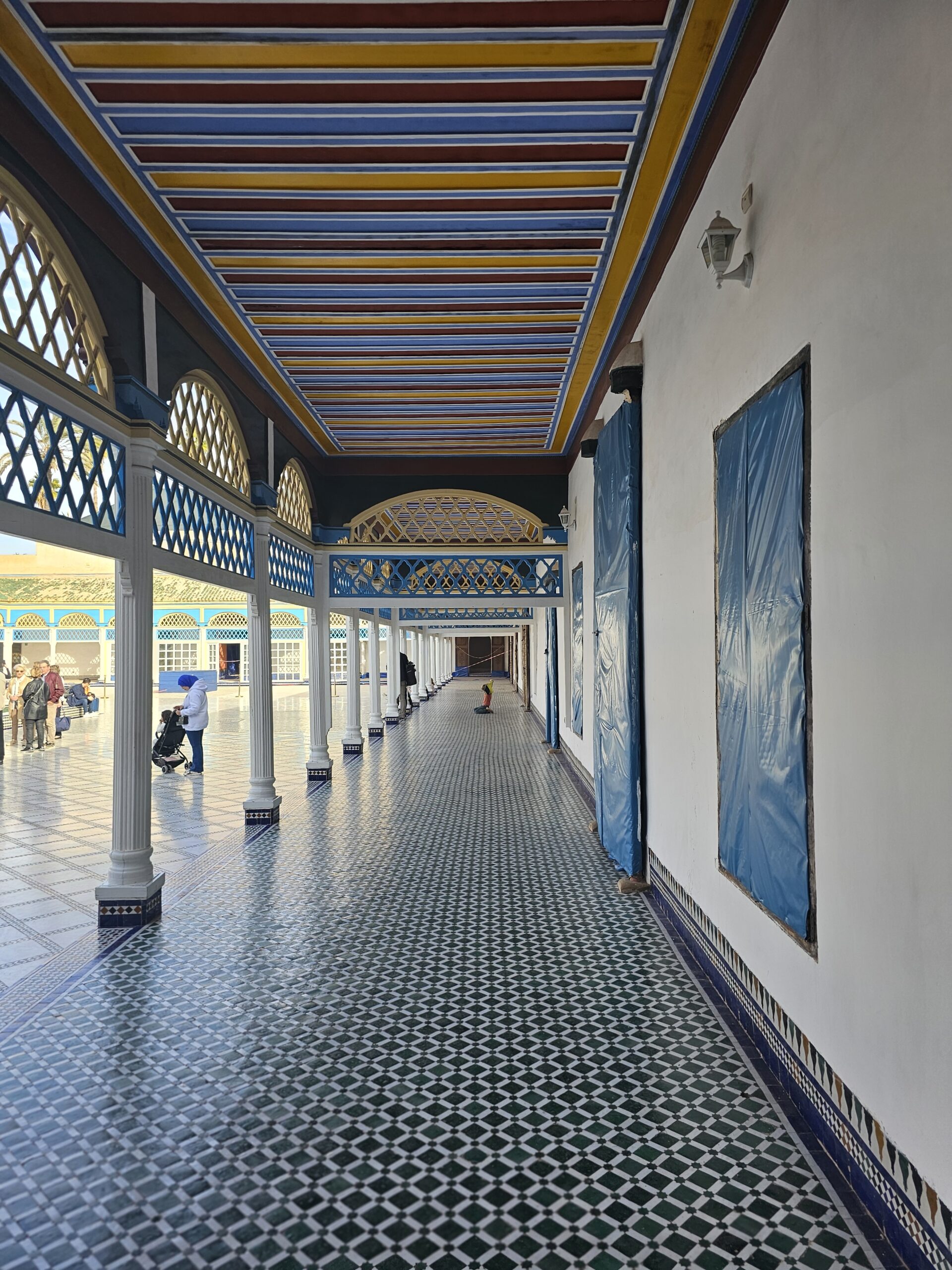 A corridor with circular columns that goes around the central courtyard of Bahia Palace, Marrakesh. Iamge by 360onhistory.com