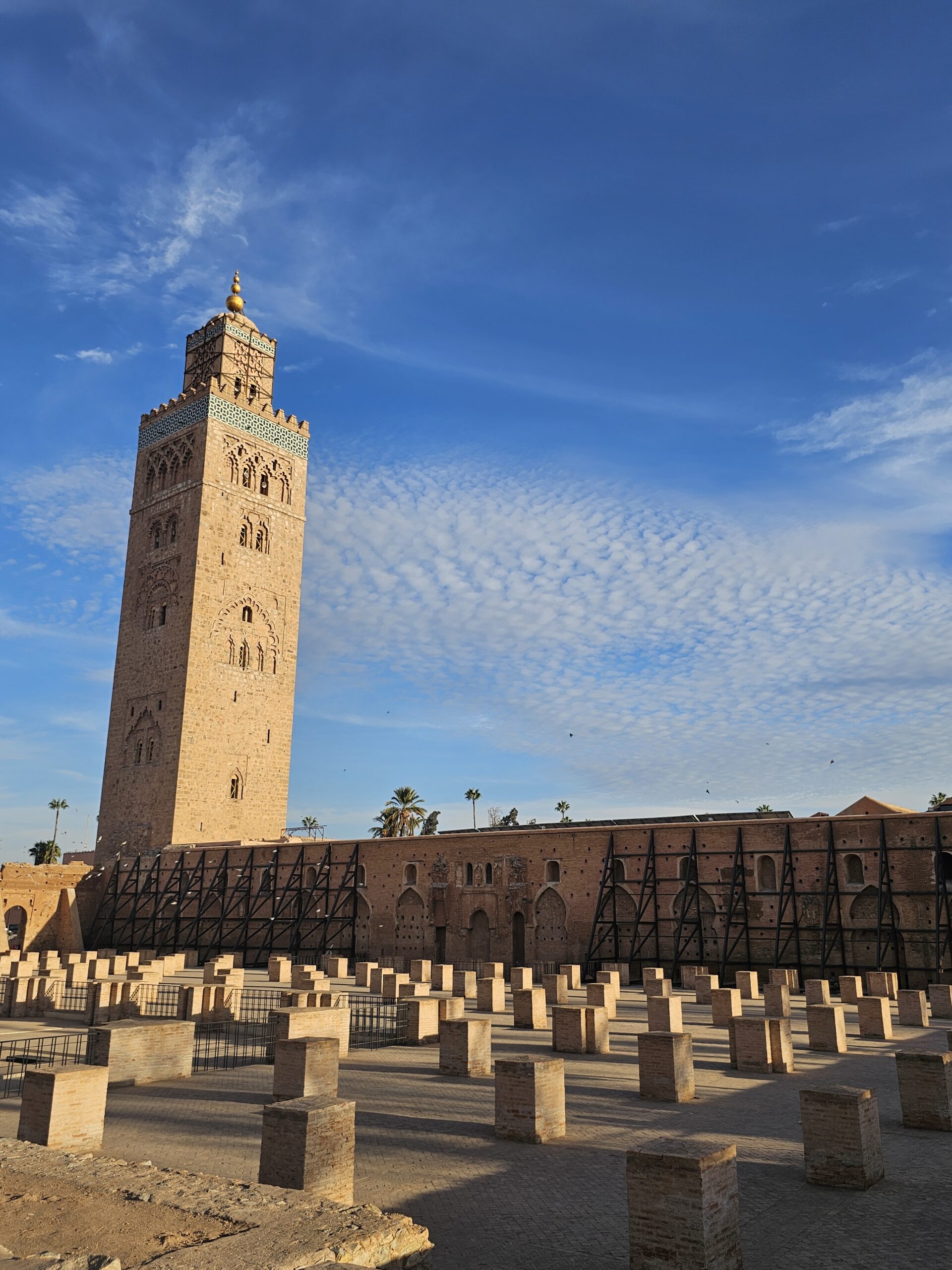Sideview of The 12th century Koutoubia Mosque and its front yard with pillars, Marrakesh. Image by 360onhistory.com