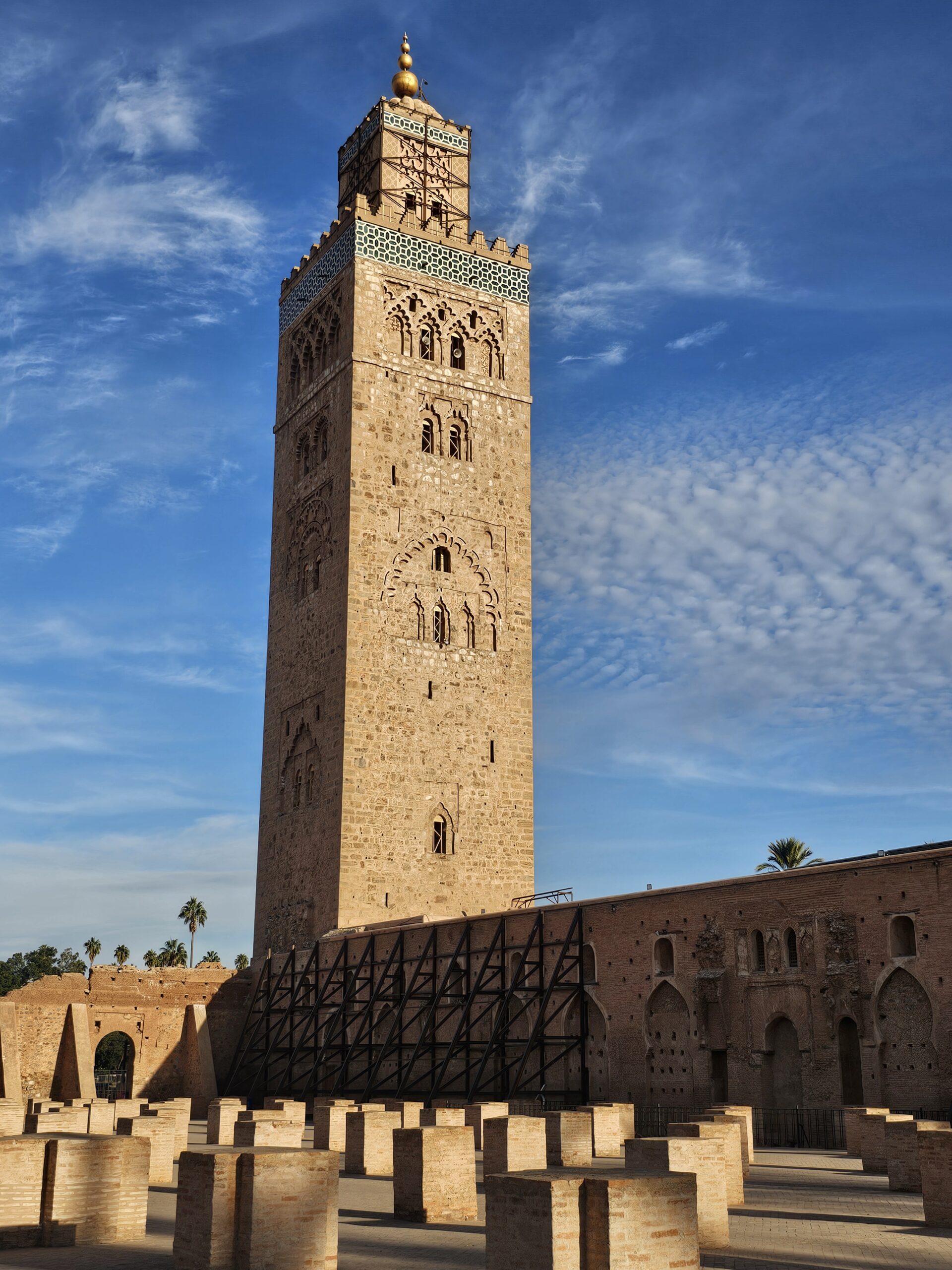Sideview of the 12th century Koutoubia Mosque and its front yard with pillars, Marrakesh. Image by 360onhistory.com