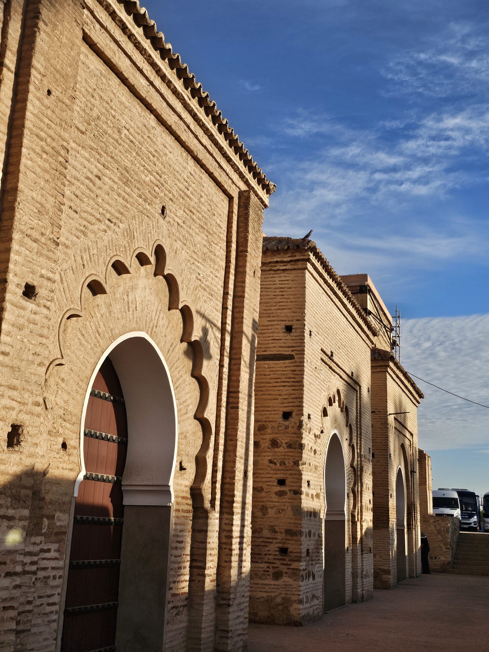 Side wall of Koutoubia Mosque with ornate islamic style porticos and doors. Image by 360onhistory.com