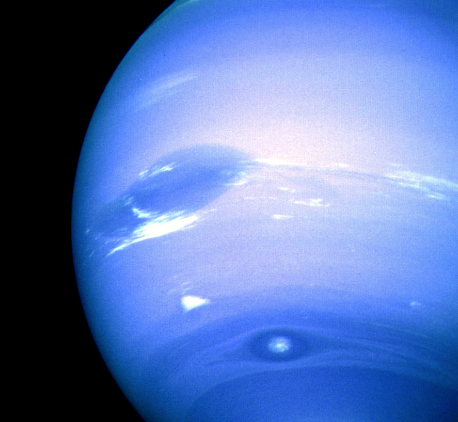 The Great Dark Spot (top), Scooter (middle white cloud),[97] and the Small Dark Spot (bottom), with contrast exaggerated.