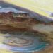 Richat Structure: A topographic reconstruction scaled 6 to1 on the vertical axis from satellite photos. False colouring as follows: Brown bedrock, Yellow or white sand, Green vegetation, Blue salty sediments